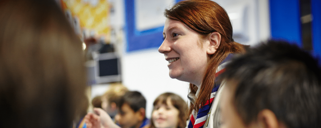 Volunteer talking to some explorers