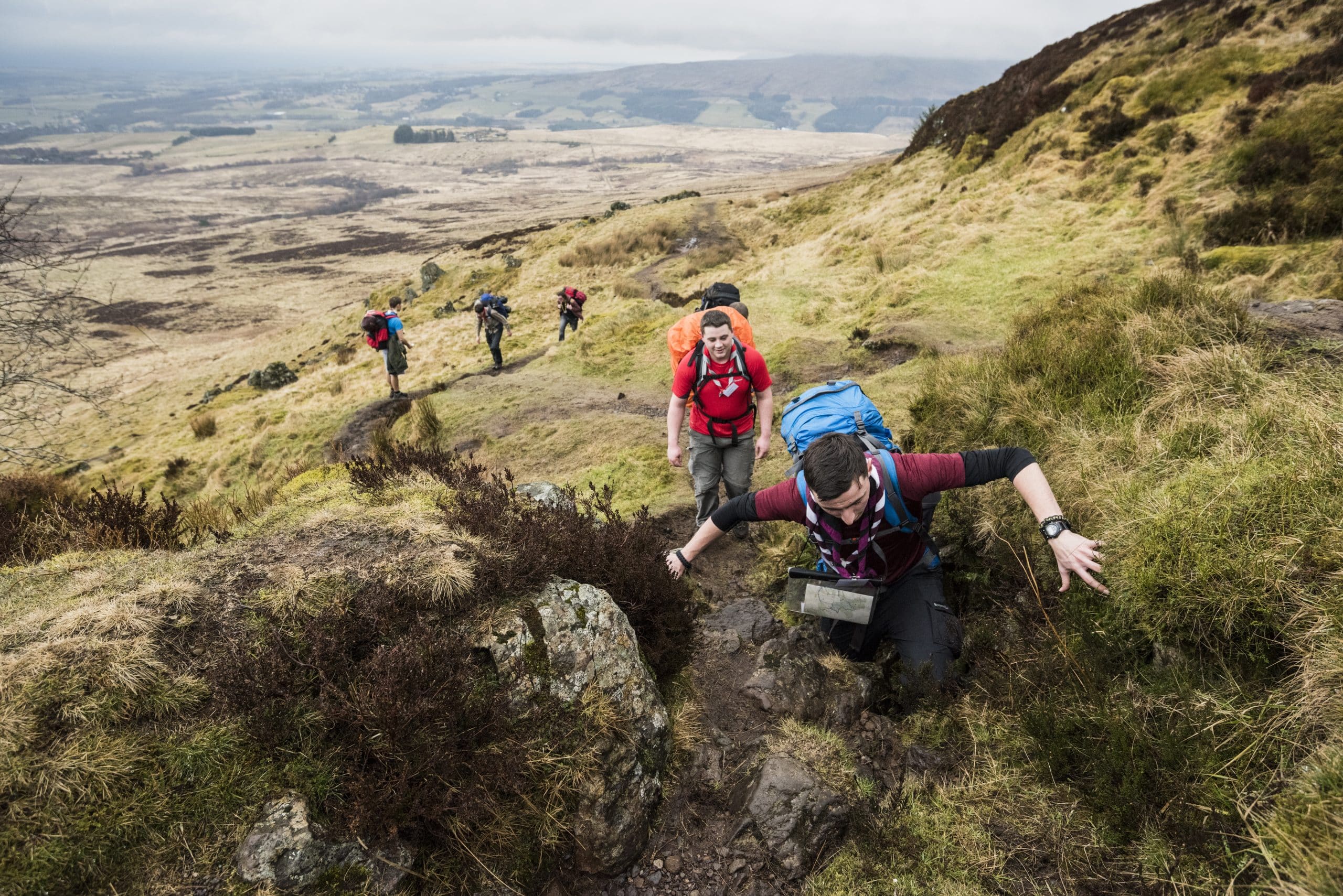 Explorer Scouts climbing a large hill